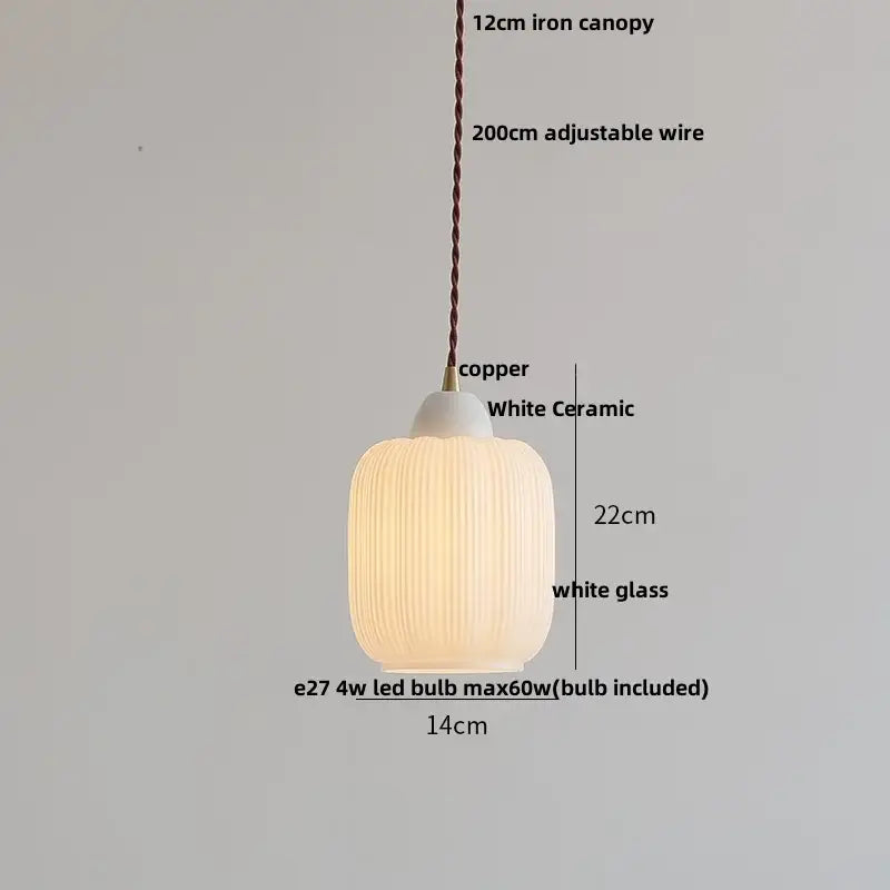 Minimalist white ceramic and glass led pendant lamp with vertical ridges and copper fitting for dining room warm glow
