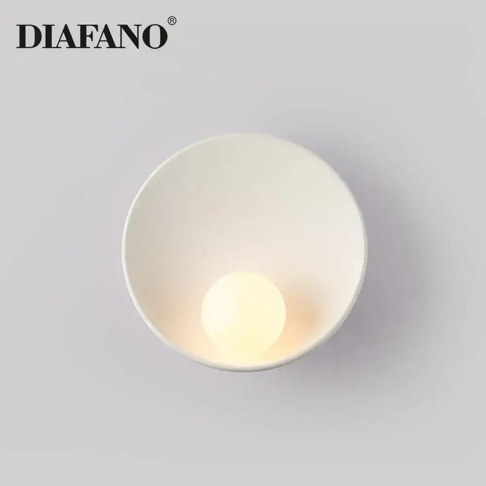 Minimalist white ceramic led wall sconce by diafano with smooth bowl design and integrated warm-toned led bulb for bedroom lighting