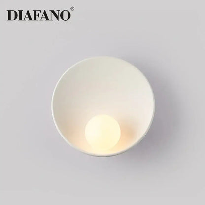 Minimalist white ceramic led wall sconce by diafano with smooth bowl design and integrated warm-toned led bulb for bedroom lighting
