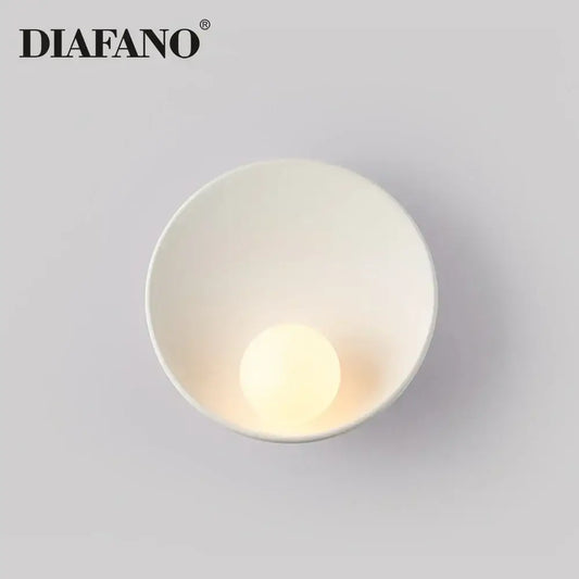 Minimalist white ceramic led wall sconce by diafano with smooth bowl design and integrated warm-toned led bulb for bedroom lighting