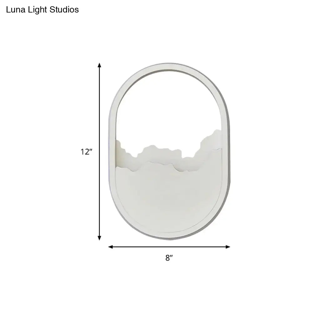 White oval mirror with minimalist frame and abstract mountain design featuring a white cloud led wall sconce wall lamp 220v-240v 110v-120v