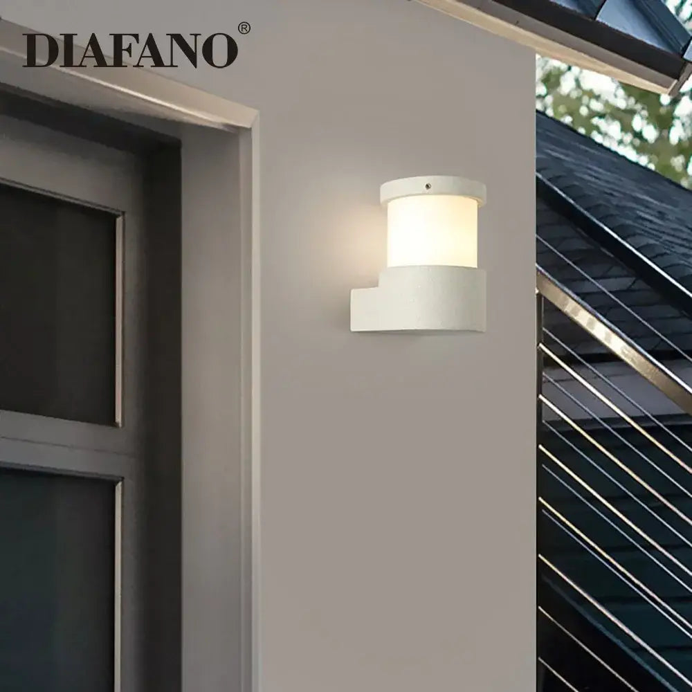 Minimalist white concrete outdoor wall lamp with a modern cylindrical design for stylish courtyard decorbites concrete outdoor use