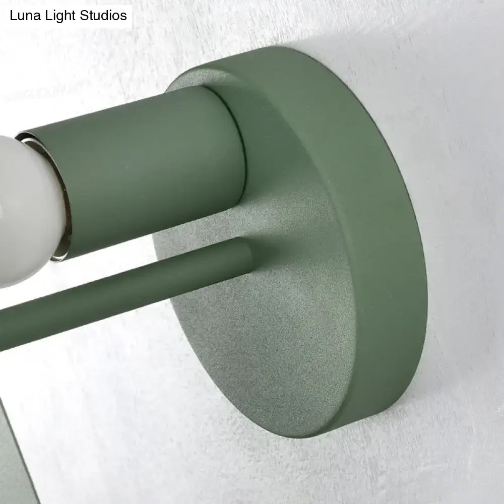 Olive green matte-finished tree wall mount bedroom sconce with cylindrical stem and circular base in green grey white