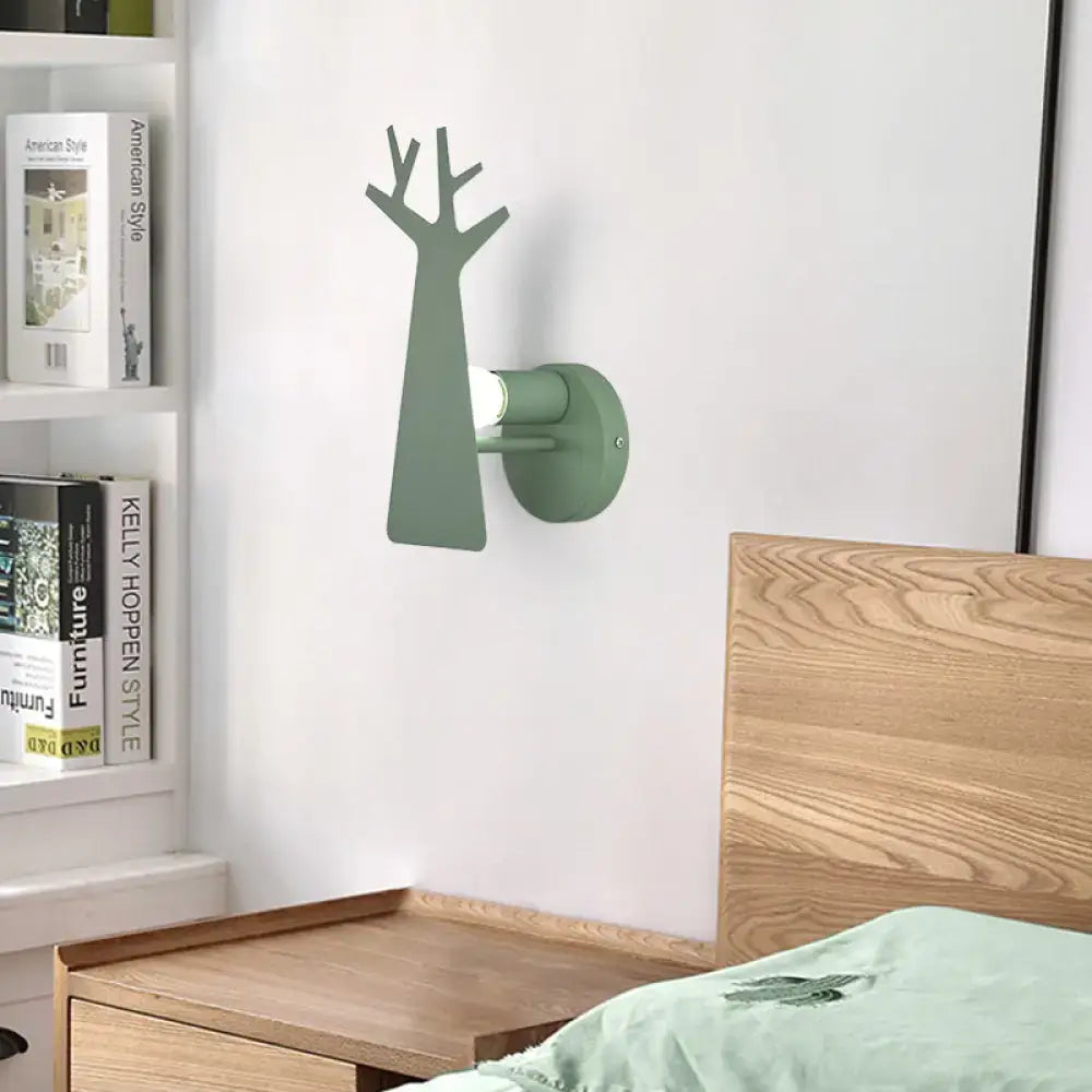 Minimalist white deer bedroom sconce featuring a sleek green grey tree wall mount with a metal design