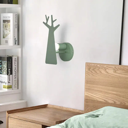 Minimalist white deer bedroom sconce featuring a sleek green grey tree wall mount with a metal design
