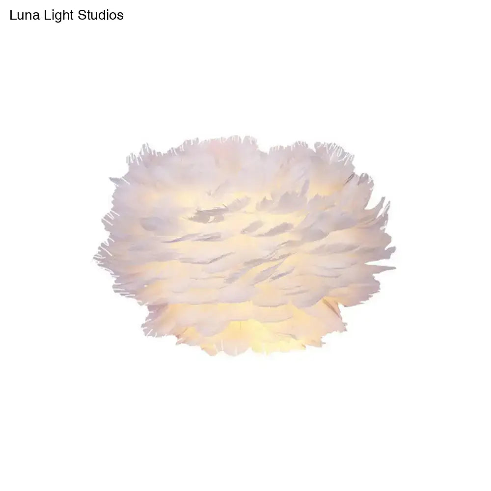 Minimalist white feather floral wall sconce with soft fluffy feathers and warm glow for a bedroom cloud light