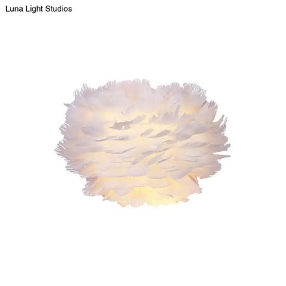 Minimalist white feather floral wall sconce with soft fluffy feathers and warm glow for a bedroom cloud light