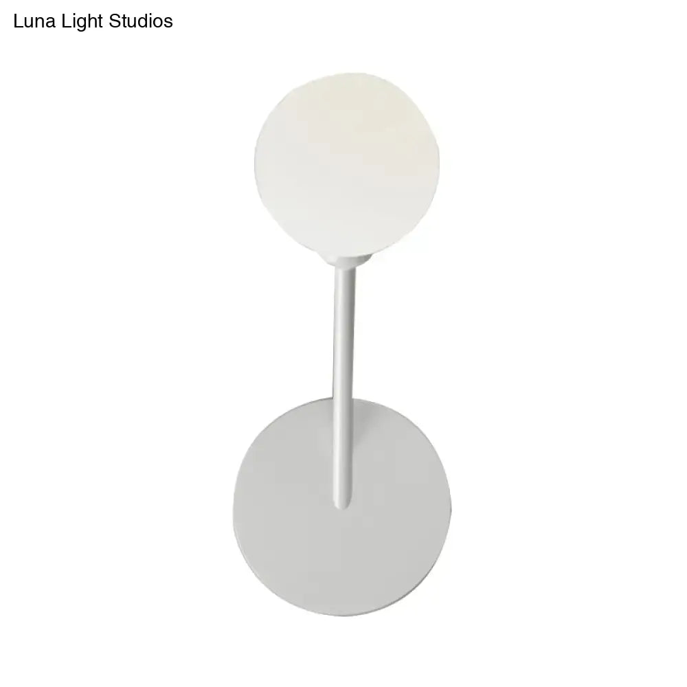 Minimalist white finish wall lamp with frosted glass spherical shade and cylindrical stem for bedroom 110v-120v use