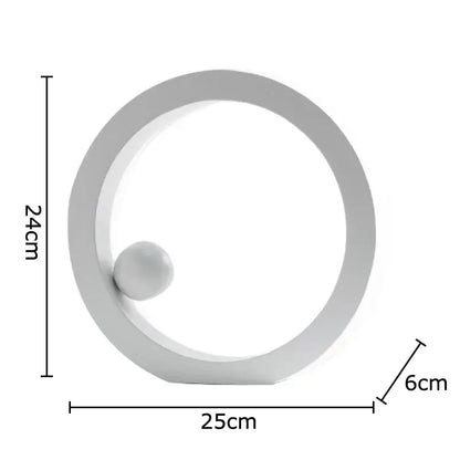 Minimalist white geometric circle desk ornament with a small sphere inside for modern office decor by decorbites geometric circle