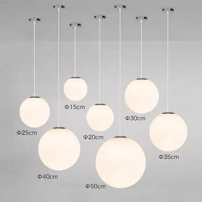 Set of minimalist white glass ball pendant lights in frosted glass with chrome fixtures for dining room decorbites glass ball