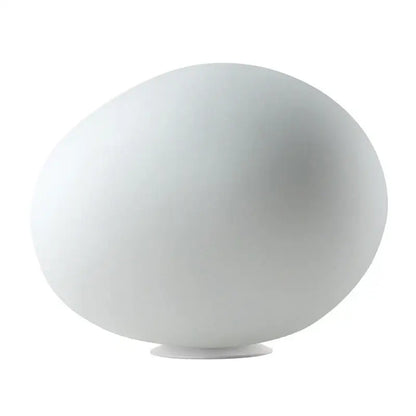 A sleek matte white ceramic floor lamp with a rounded goose egg led design for minimalist decorbites bedroom decor