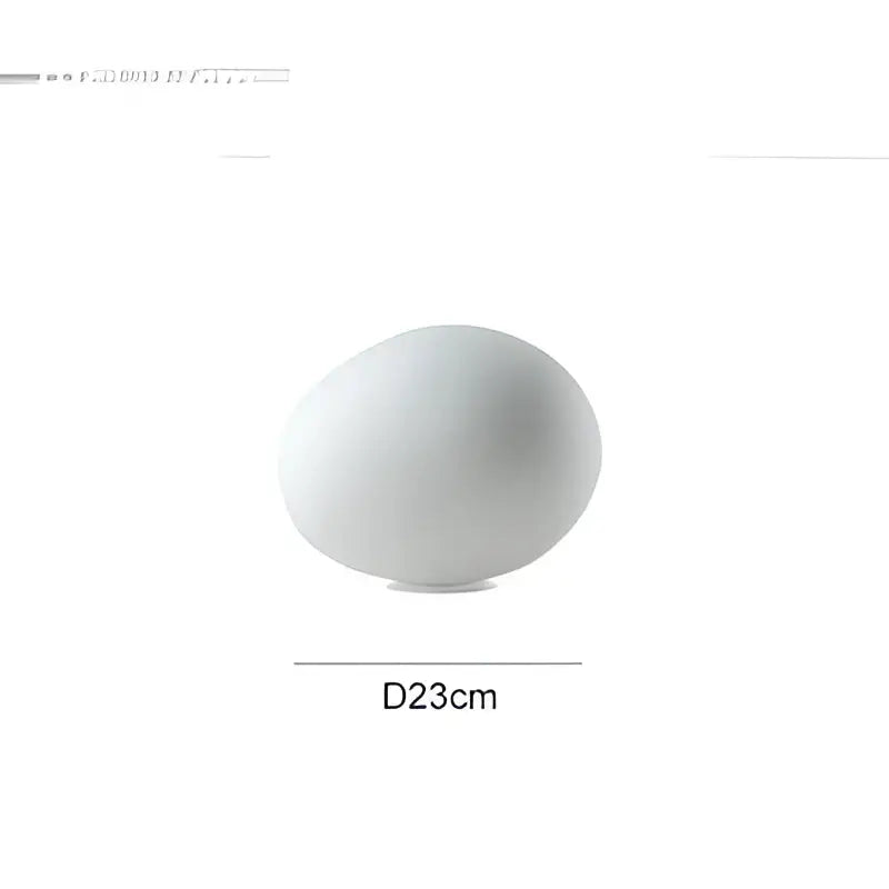 A sleek matte white ceramic floor lamp with a rounded globe shade minimalist decorbites goose egg led design