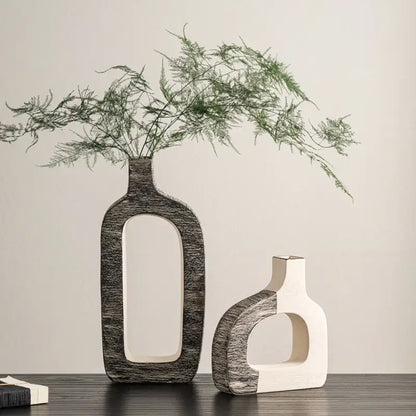 Two modern ceramic flower vases in white and gray with geometric stripes for minimalist living room decor