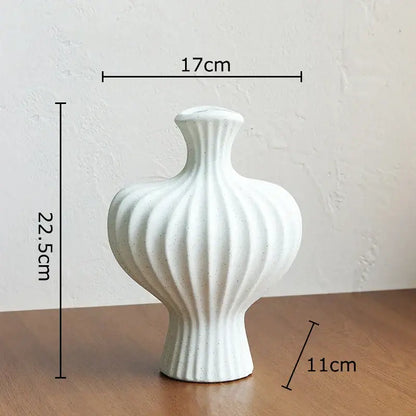 Minimalist white heart shape ceramic vase with vertical ridges and speckled finish for living room decorbites decor