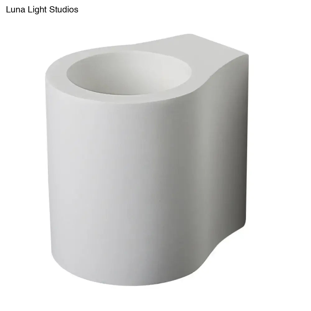 Minimalist white ceramic cylindrical flush wall sconce with matte finish and curved top edge for bedroom wall lamp