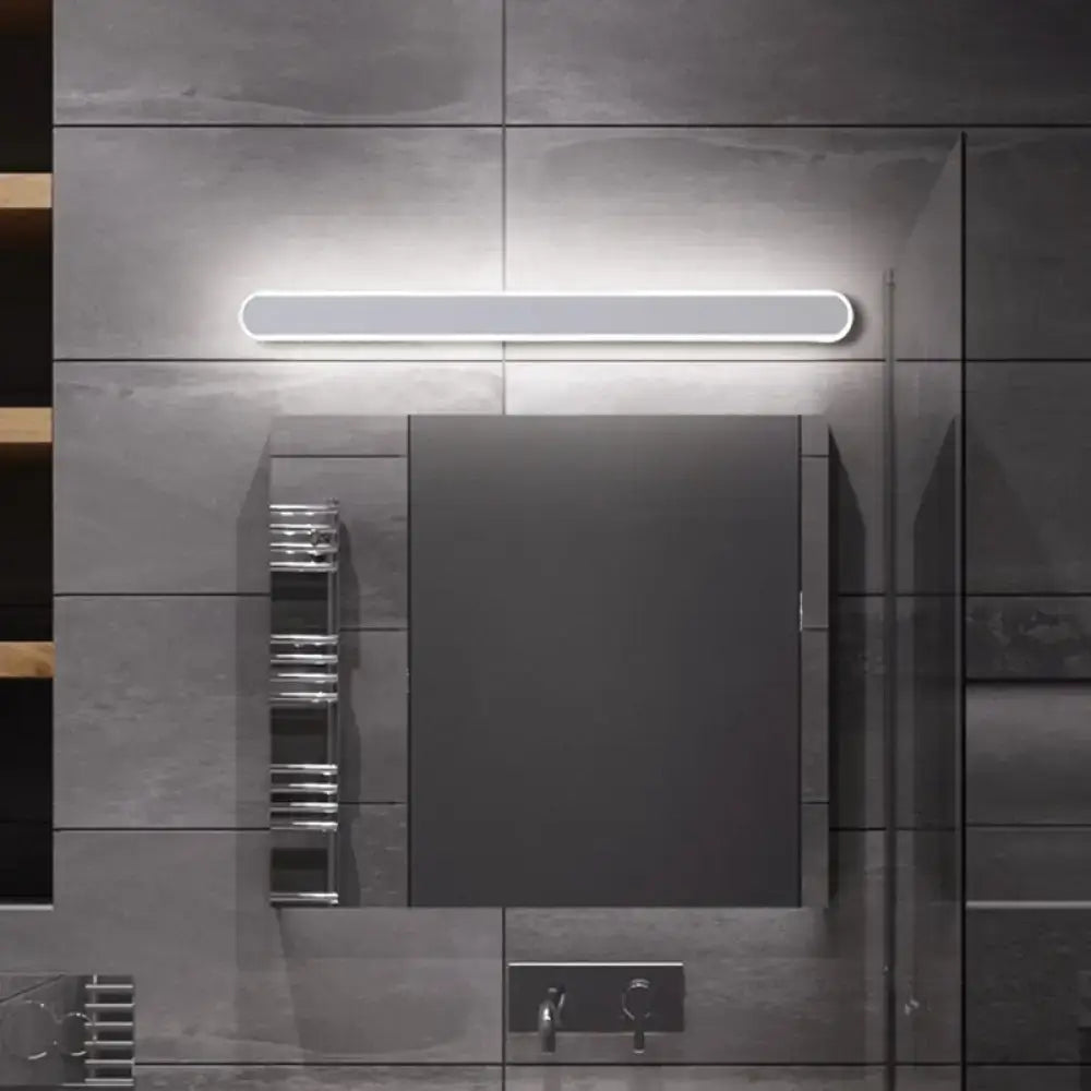Modern rectangular led bathroom mirror wall sconce with warm white light and sleek white illuminated strip above dark gray cabinet