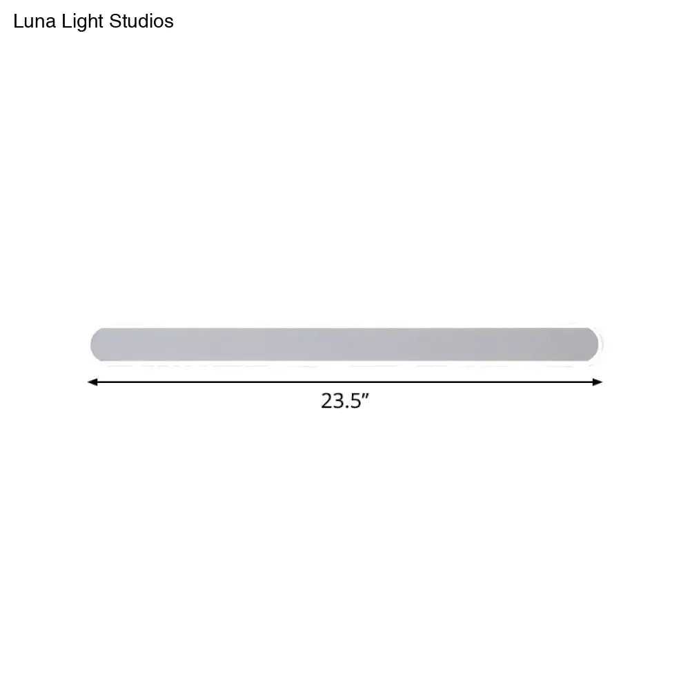 Minimalist gray rectangular wall sconce with smooth finish and warm white light for bathroom mirror lighting