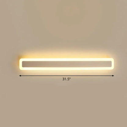 A sleek minimalist white led vanity light wall sconce with warm third glow for bathroom lighting