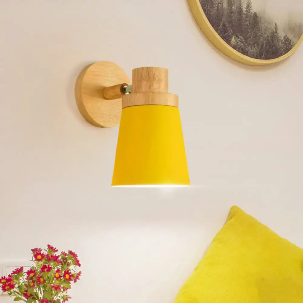 Yellow conical wall lamp sconce with natural wood base and mounting plate for minimalist living room decor