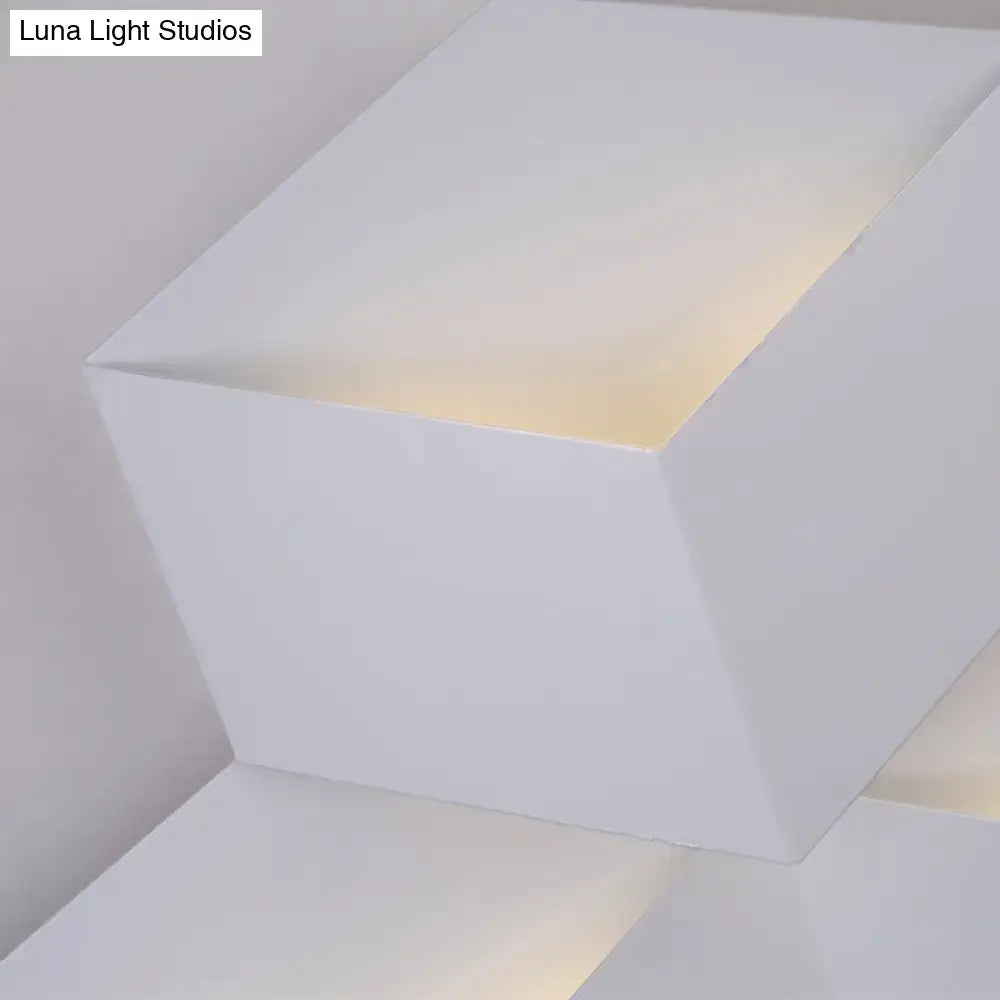 Minimalist white metallic geometric wall mount wall lamp with a soft warm glow for corridor lighting
