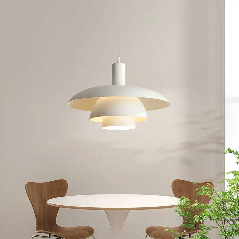 Minimalist white pendant lamp with layered petal-like shades and sleek stem in decorbites cream style for dining room