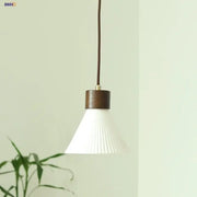Minimalist white pleated glass pendant light with dark wood metal collar for dining room home decor by decorbites ceramic led