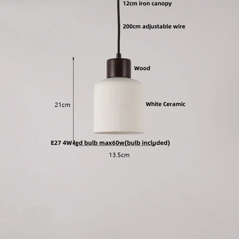 Minimalist white ceramic pendant light with ribbed texture and dark wood top for dining room home decor by decorbites ceramic led