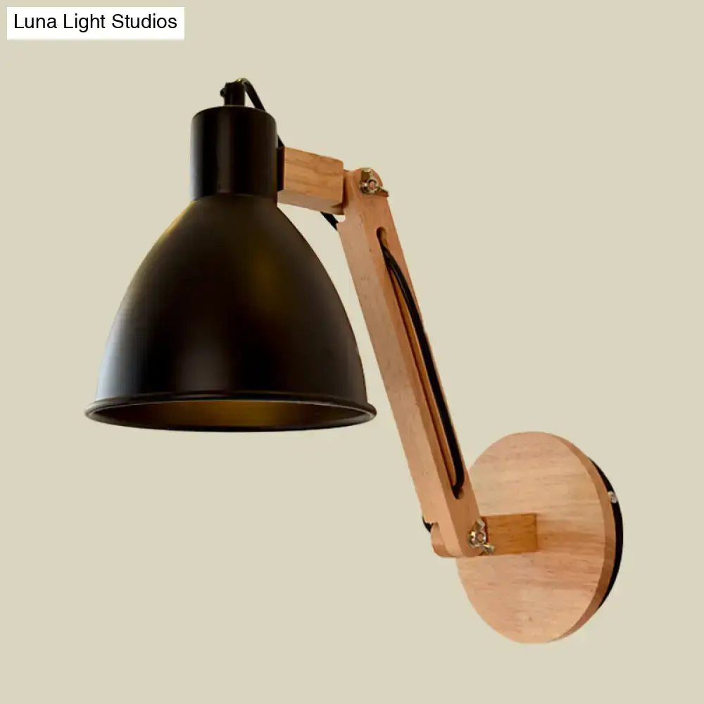 Minimalist black metal swing arm wall light with wooden articulated arm and brass hardware for bedroom use