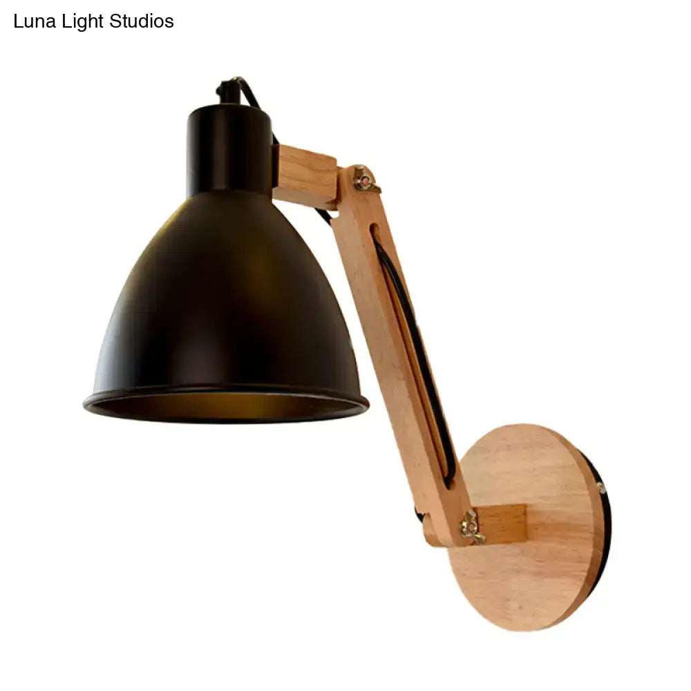 Black metal swing arm wall light with wooden articulated arm and circular mount in white black finish for bedroom use