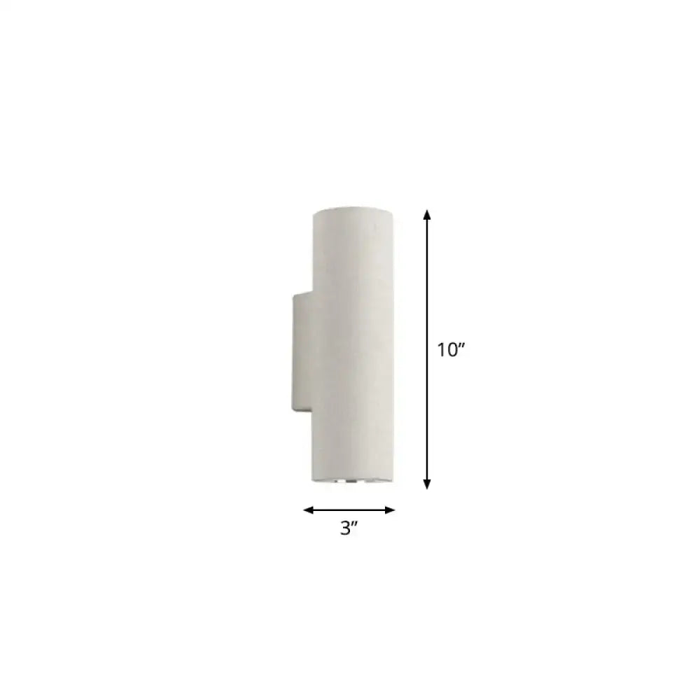Minimalist white terrazzo stair wall sconce with a sleek cylindrical design and compact fixture height for space efficiency