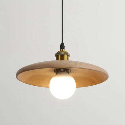 Minimalist wood and brass pendant light with warm-toned disc shade black cord and led bulb with three-color dimming