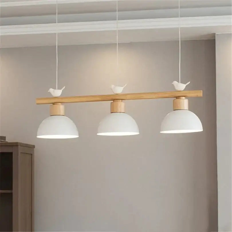 Minimalist wood and white decorbites bird light pendant with natural wood bar and white ceramic birds for dining room