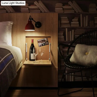 Red industrial-style wall lamp with black arm and base wall mounted lamp ideal for living room lighting