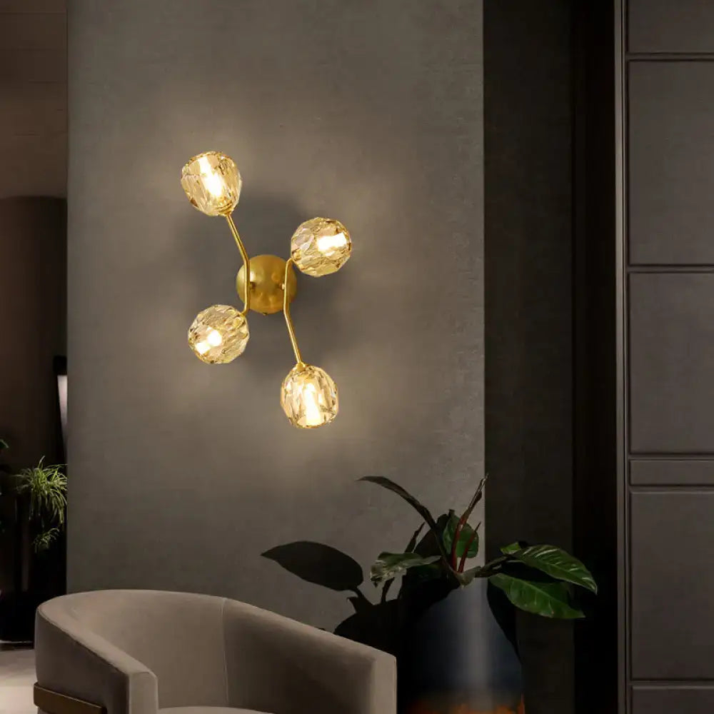 Gold-toned minimalistic brass branch wall light with four faceted crystal globe shades for bedroom wall lamp