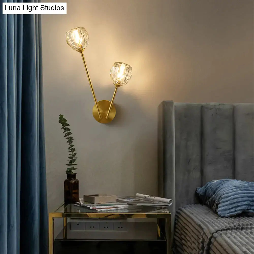 Gold-toned brass branch wall light with two faceted glass globe shades for bedroom minimalistic wall lamp