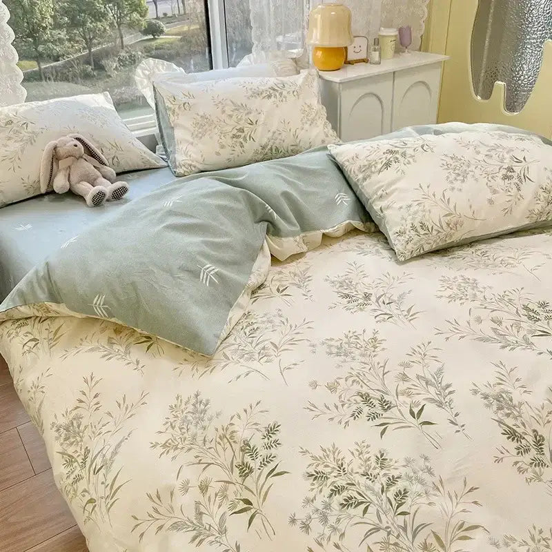 Soft mint green and cream floral print cotton bedding set featuring delicate botanical prints for bedroom use