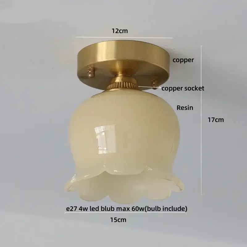 A vintage ceiling light with brass copper base and off-white scalloped resin shade for decorbites blue flower glass decor