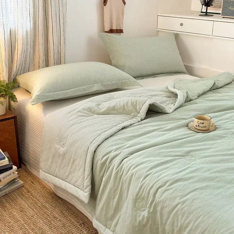Soft mint green cotton summer cooling quilted comforter with subtle stitching and plush decorbites cotton summer design