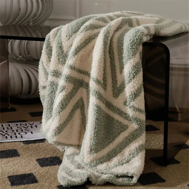 A cream and sage green plush knitted jacquard blanket with soft fleece material for decorbites knitted jacquard decor