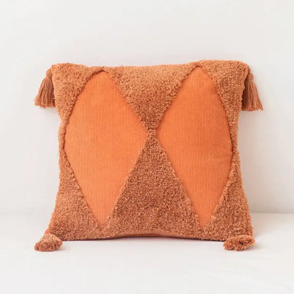 Cozy terracotta square tassel cushion cover with textured fuzzy fabric and corduroy x-pattern panels for living room use