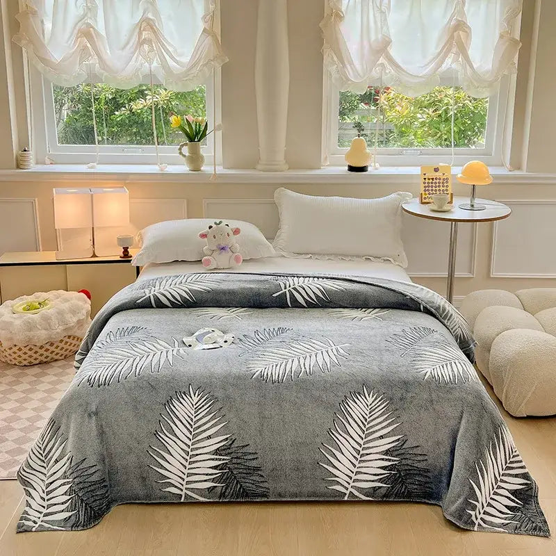 Gray plush blanket with white and black palm leaf pattern complementing decorbites dinosaur patterns snowflake velvet blanket