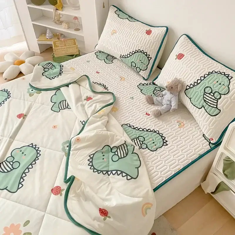 Mint green dinosaur summer quilt and latex fitted sheet set with soft textured surface and teal piping accents