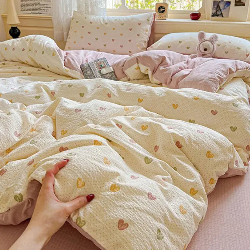 Cream-colored quilted duvet cover set with multicolored pastel hearts in a mint green floral double layer yarn design