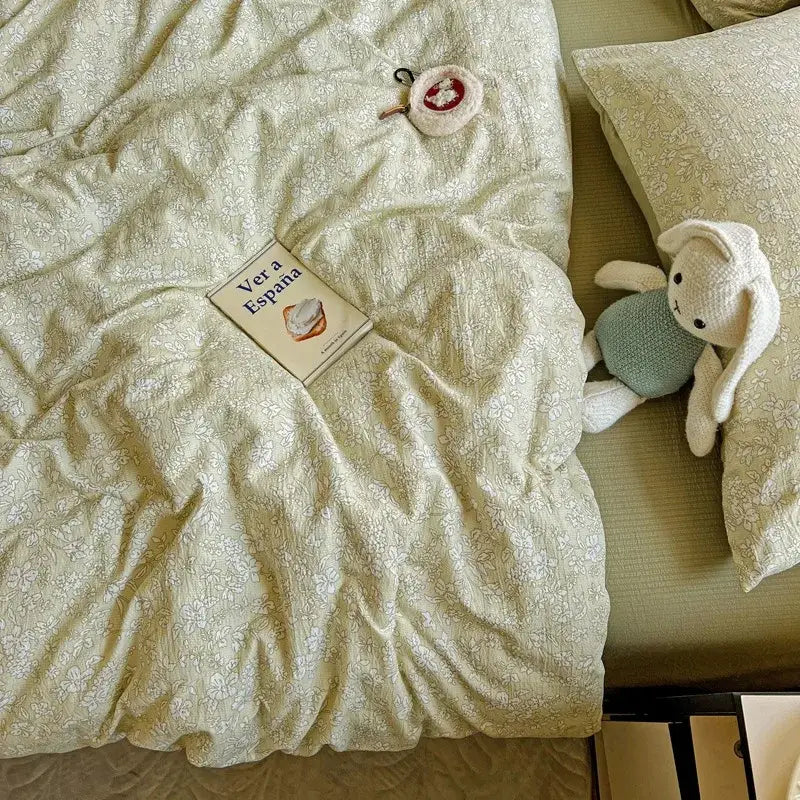 Cream-colored floral-patterned cotton duvet cover set with matching pillowcases in a mint green floral double layer yarn cover set