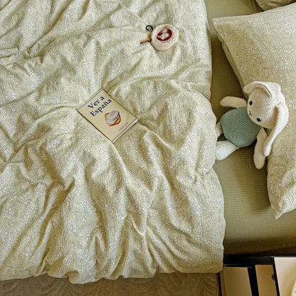Cream-colored floral-patterned cotton duvet cover set with matching pillowcases in a mint green floral double layer yarn cover set