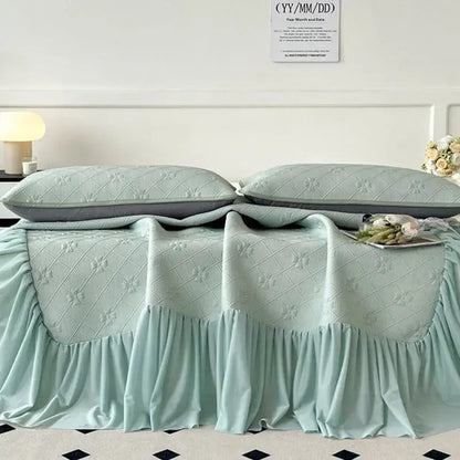 Mint green floral quilted bed skirt set with ruffled hem and floral embroidery for bedroom mattress mat