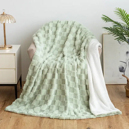 A soft mint green geometric jacquard flannel sofa cover with a textured checkered pattern and white lining