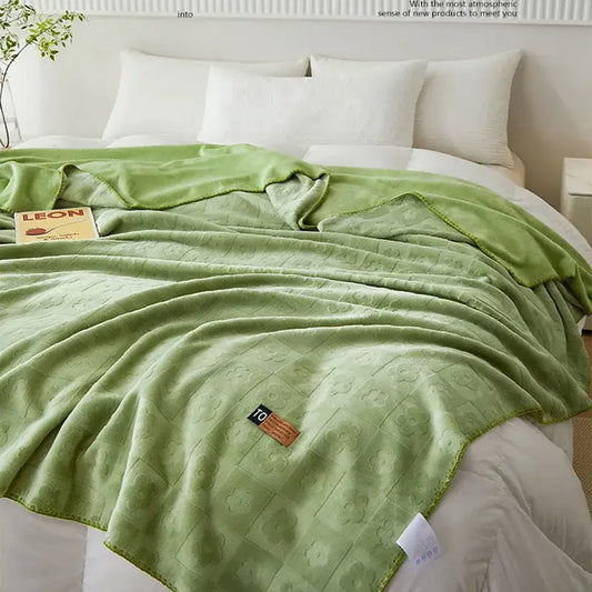 Soft mint green jacquard milk velvet blanket with subtle floral pattern and stitched edges for decorbites jacquard milk use