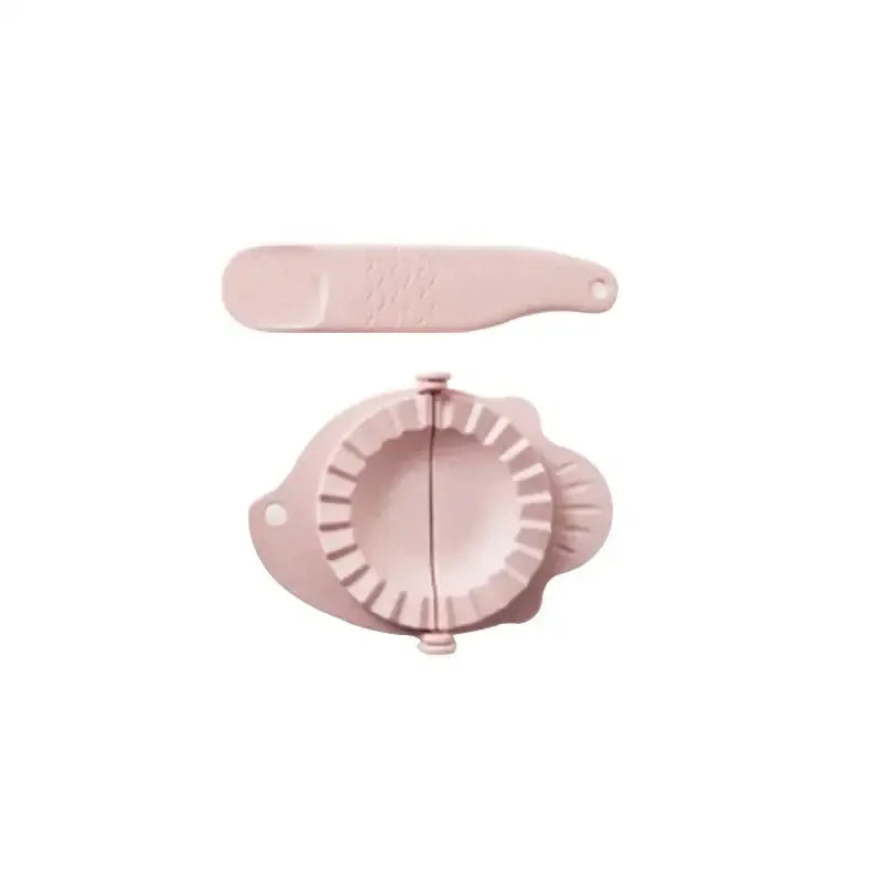 Pink plastic dumplings maker tool with matching pressing tool ideal for kitchen use and dumpling preparation