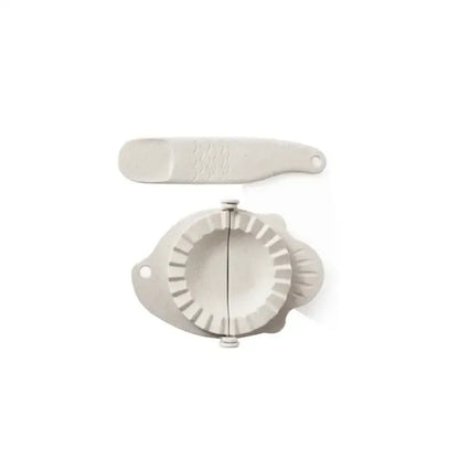 White silicone dumplings maker tool with fluted edge and handle for easy kitchen use